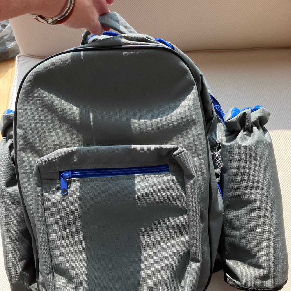 Gray picnic Backpack with Blue Accents with four settings